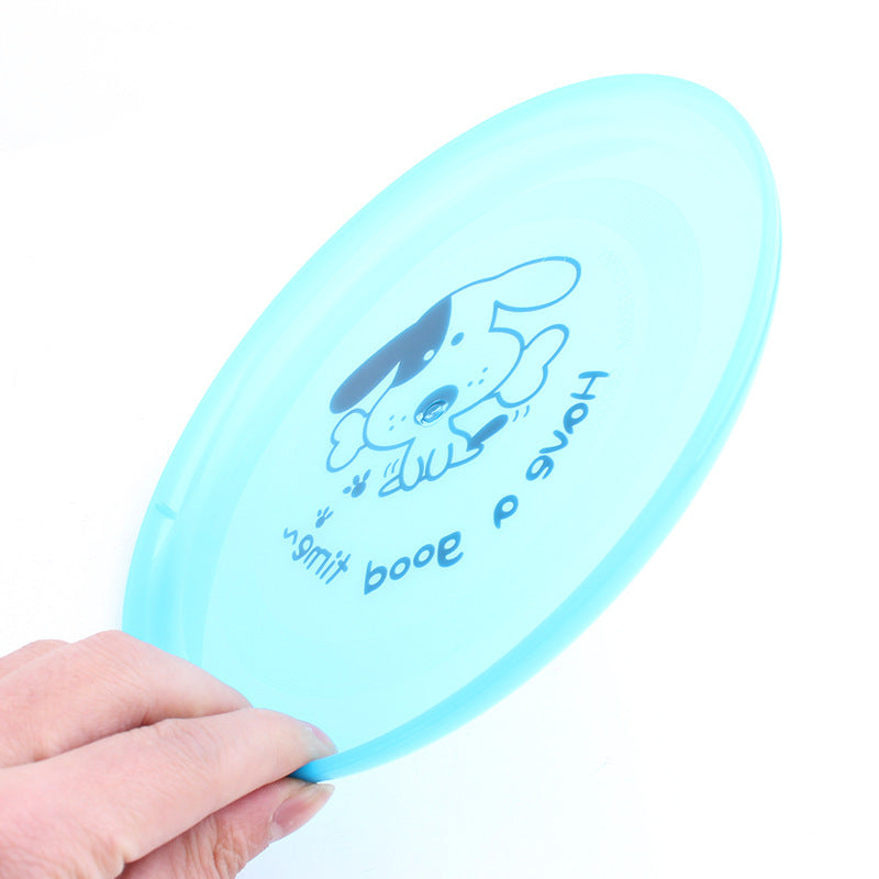 Dog playing with flying disc toy