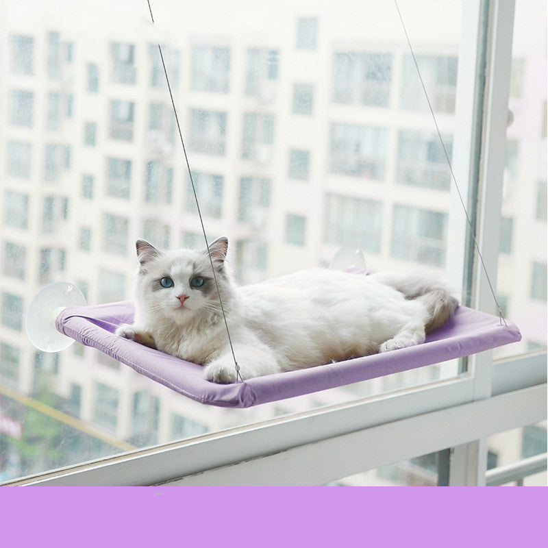 Suction-Cup Cat Window Hammock mounted on a window with a cat lounging