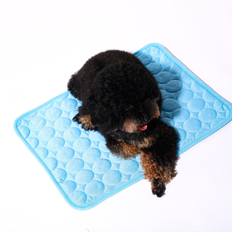 Dog relaxing on self-cooling gel mat