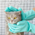 Silicone grooming glove gently petting a cat's head