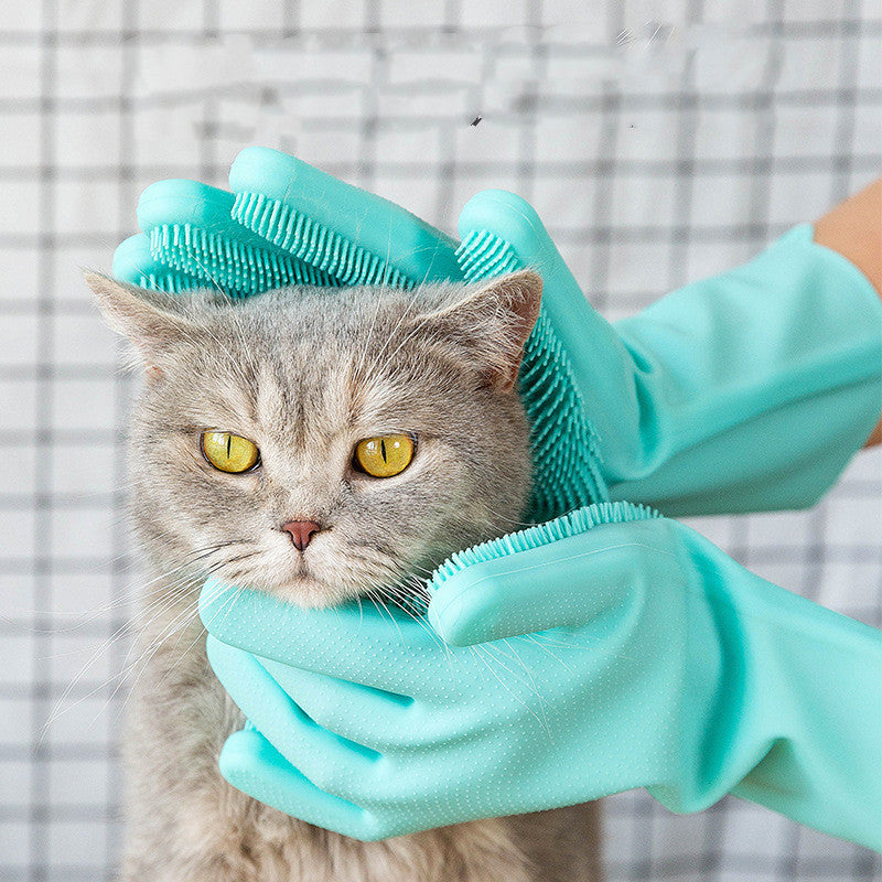 Silicone grooming glove gently petting a cat's head