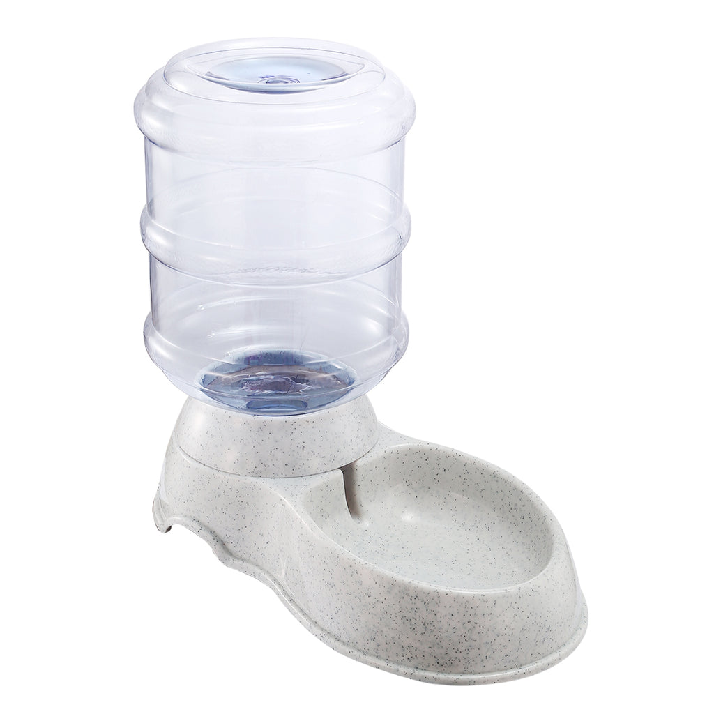Dog drinking from gravity pet waterer